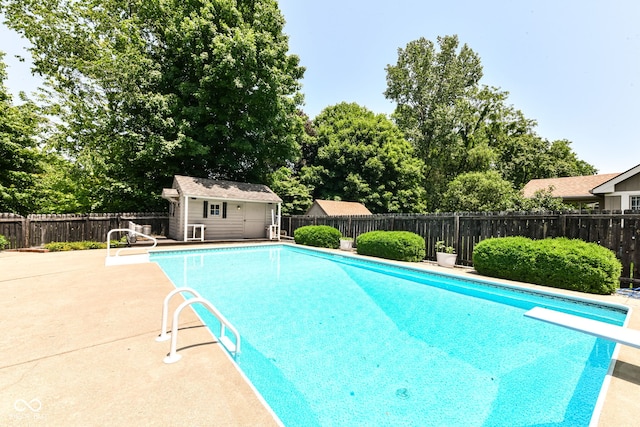 6580 Kings Ct, Avon, IN 46123 - view of pool featuring a diving board, a fenced backyard, and an outbuilding