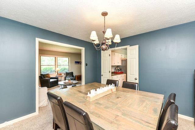 6580 Kings Ct, Avon, IN 46123 - dining room featuring a chandelier, carpet, and a textured ceiling