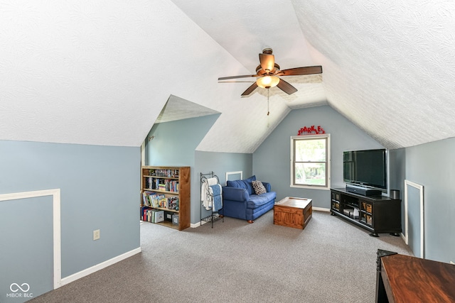 6580 Kings Ct, Avon, IN 46123 - carpeted living area with vaulted ceiling, a ceiling fan, and a textured ceiling