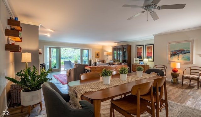 131 Olde Mill Bay, Indianapolis, IN 46260 - dining space with ornamental molding, ceiling fan, light wood finished floors, and baseboards