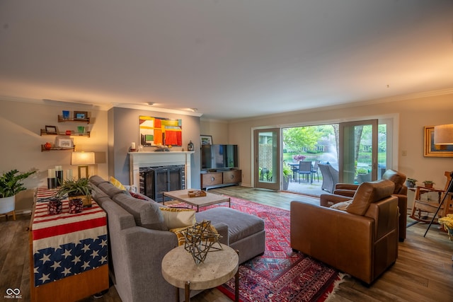 131 Olde Mill Bay, Indianapolis, IN 46260 - living area featuring crown molding, wood finished floors, and a fireplace
