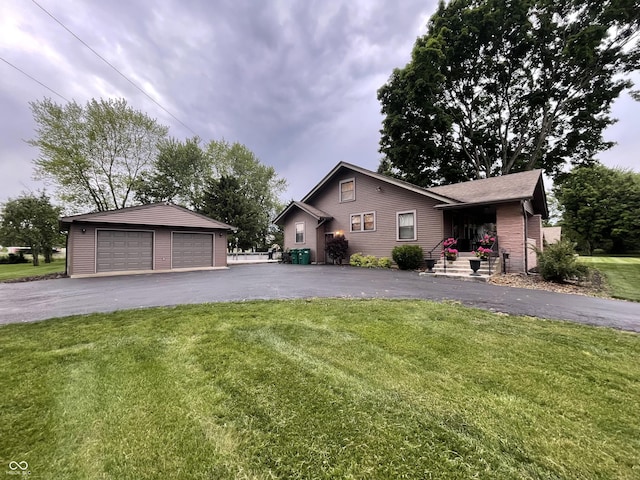 9467 N Michigan Rd, Fairland, IN 46126 - ranch-style house featuring an outdoor structure, a detached garage, and a front lawn