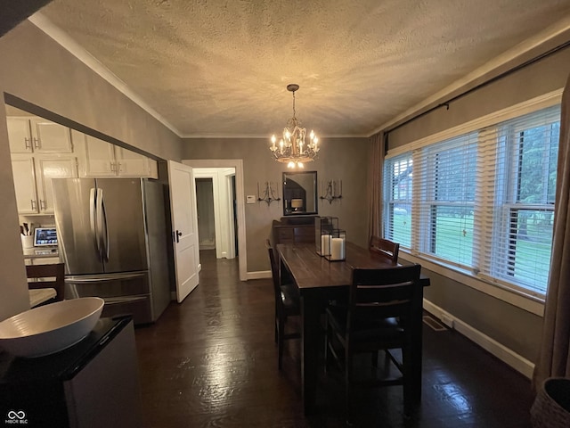 9467 N Michigan Rd, Fairland, IN 46126 - dining room featuring a textured ceiling, a chandelier, baseboards, dark wood finished floors, and ornamental molding