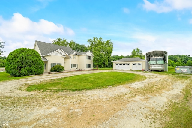 5439 E Kinderhook Rd, Scottsburg, IN 47170 - view of front of home featuring driveway, a detached carport, a front lawn, an outdoor structure, and a detached garage