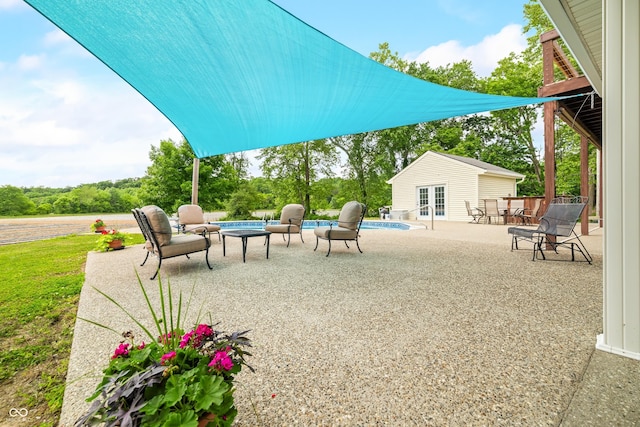 5439 E Kinderhook Rd, Scottsburg, IN 47170 - view of patio with an outdoor pool, french doors, an outdoor structure, and a storage structure