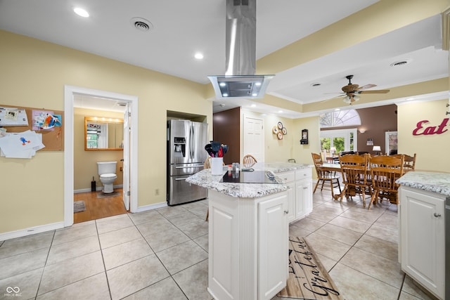 5439 E Kinderhook Rd, Scottsburg, IN 47170 - kitchen featuring stainless steel fridge with ice dispenser, a center island, white cabinets, a ceiling fan, and island range hood