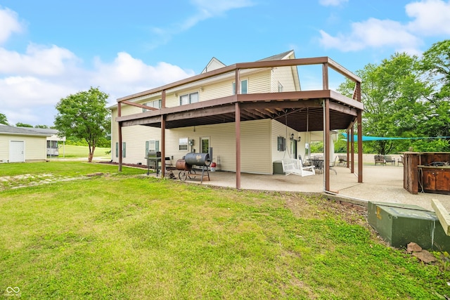5439 E Kinderhook Rd, Scottsburg, IN 47170 - rear view of house featuring a lawn and a patio