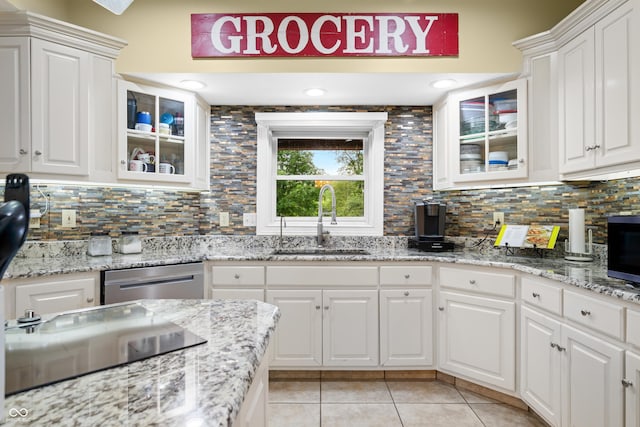5439 E Kinderhook Rd, Scottsburg, IN 47170 - kitchen with a sink, dishwasher, light tile patterned floors, black electric stovetop, and white cabinetry