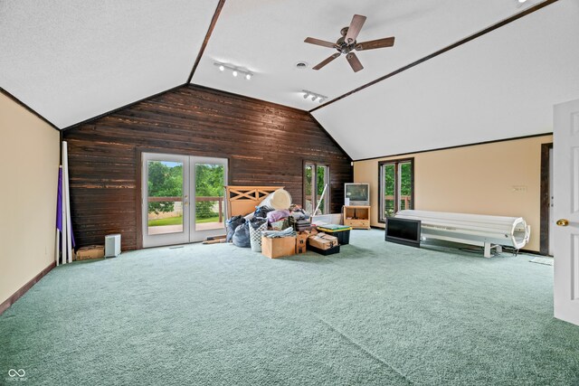 5439 E Kinderhook Rd, Scottsburg, IN 47170 - carpeted living area with wooden walls, vaulted ceiling, a ceiling fan, and baseboards