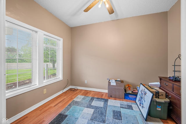 5439 E Kinderhook Rd, Scottsburg, IN 47170 - unfurnished bedroom featuring wood finished floors, baseboards, and ceiling fan