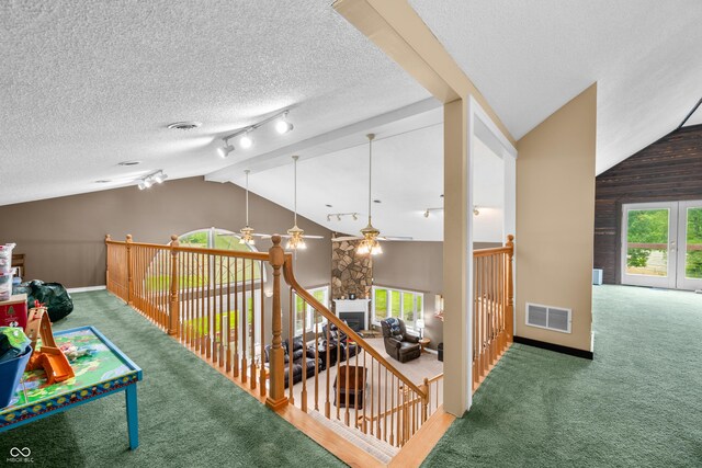 5439 E Kinderhook Rd, Scottsburg, IN 47170 - corridor featuring vaulted ceiling, carpet, baseboards, track lighting, and a textured ceiling