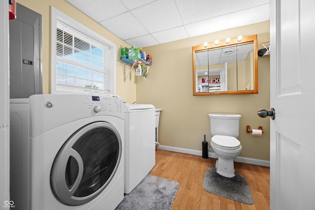 5439 E Kinderhook Rd, Scottsburg, IN 47170 - laundry area with washer and clothes dryer, baseboards, electric panel, and light wood-style floors