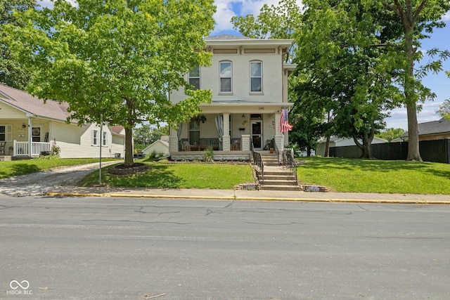245 S Washington St, Danville, IN 46122 - view of front facade featuring a porch and a front lawn