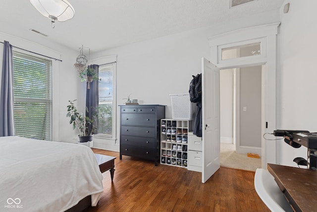 245 S Washington St, Danville, IN 46122 - bedroom featuring wood finished floors and multiple windows