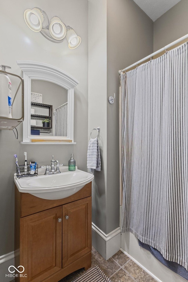 245 S Washington St, Danville, IN 46122 - full bathroom with vanity, tile patterned flooring, and baseboards