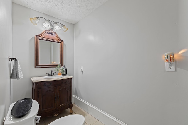 245 S Washington St, Danville, IN 46122 - bathroom featuring vanity, a textured ceiling, toilet, tile patterned floors, and baseboards