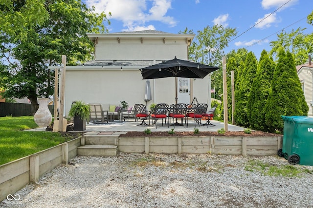 245 S Washington St, Danville, IN 46122 - back of property with stucco siding and a patio