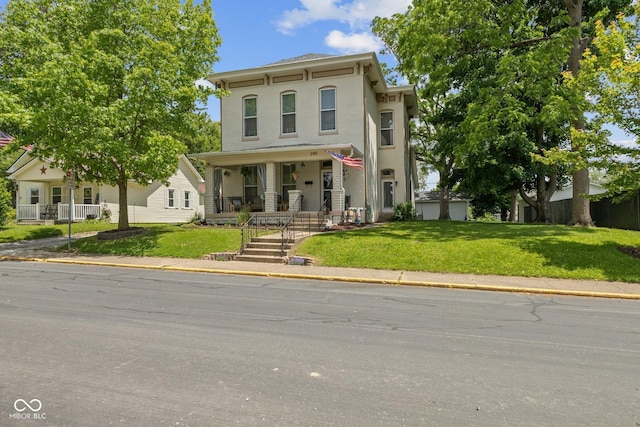245 S Washington St, Danville, IN 46122 - italianate-style house with a porch, stucco siding, and a front yard