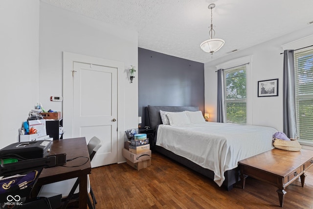 245 S Washington St, Danville, IN 46122 - bedroom with dark wood finished floors, a textured ceiling, and a desk