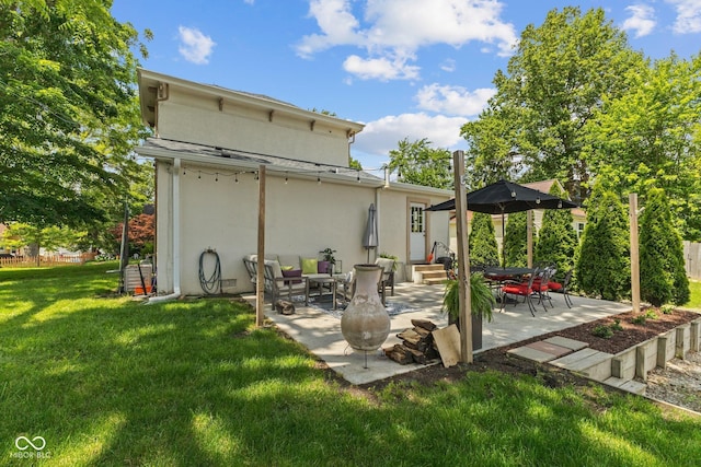 245 S Washington St, Danville, IN 46122 - rear view of property featuring stucco siding, a patio, and entry steps
