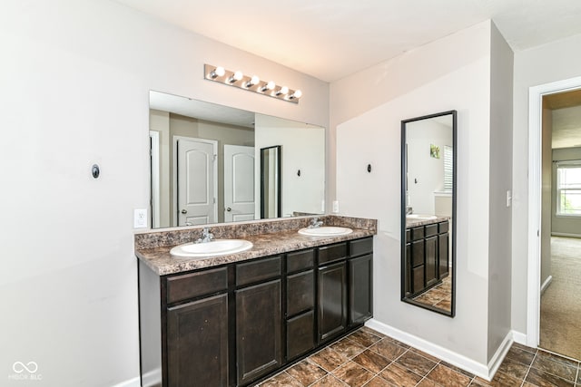 4650 Blue Marlin Way, Indianapolis, IN 46239 - bathroom with double vanity and baseboards