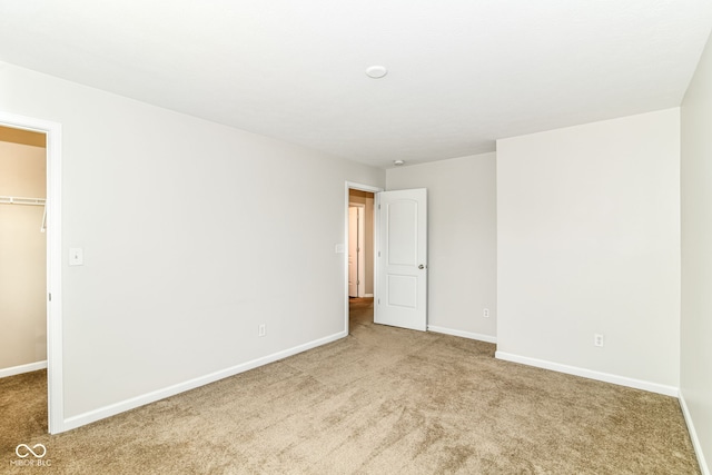 4650 Blue Marlin Way, Indianapolis, IN 46239 - unfurnished bedroom featuring a spacious closet, carpet floors, and a closet