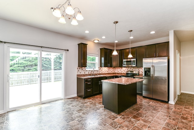 4650 Blue Marlin Way, Indianapolis, IN 46239 - kitchen with appliances with stainless steel finishes, healthy amount of natural light, a chandelier, backsplash, and recessed lighting