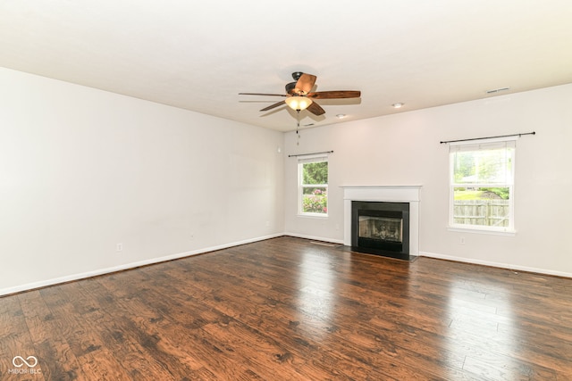 4650 Blue Marlin Way, Indianapolis, IN 46239 - unfurnished living room with a ceiling fan, a fireplace with flush hearth, and dark wood-style floors