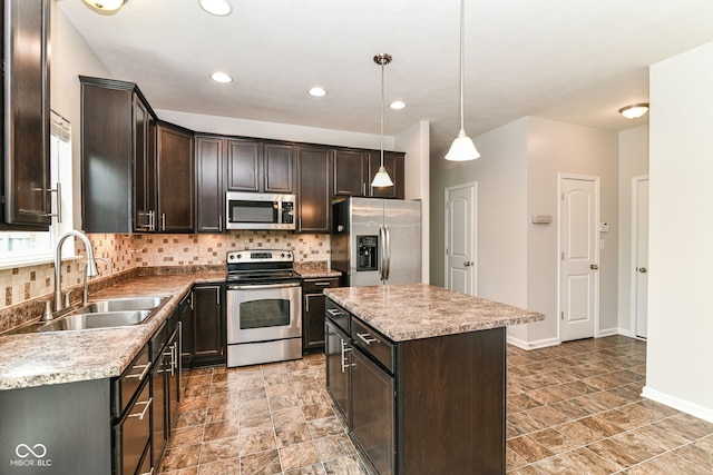 4650 Blue Marlin Way, Indianapolis, IN 46239 - kitchen featuring stainless steel appliances, dark brown cabinets, tasteful backsplash, a kitchen island, and stone finish floors