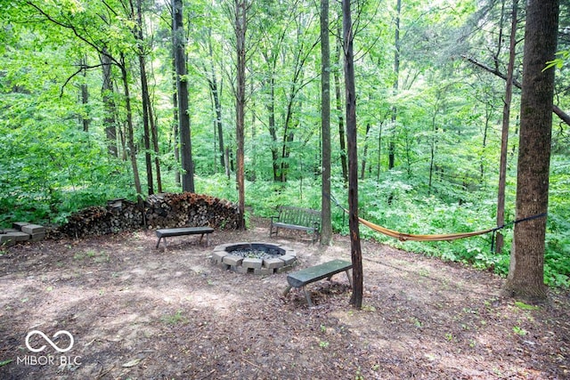 845 S Bay, North Vernon, IN 47265 - view of yard with an outdoor fire pit and a forest view