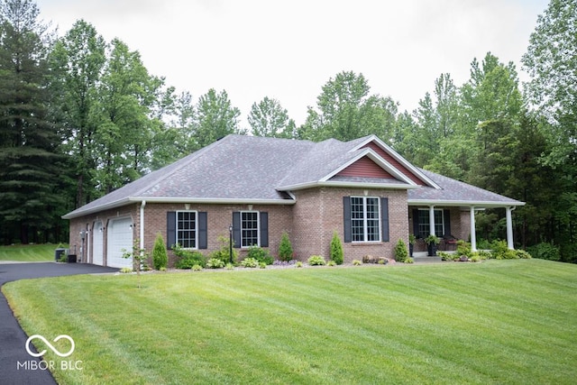 845 S Bay, North Vernon, IN 47265 - single story home featuring an attached garage, driveway, brick siding, a front lawn, and a porch