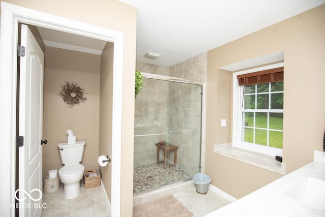 845 S Bay, North Vernon, IN 47265 - bathroom featuring a stall shower, toilet, tile patterned flooring, baseboards, and vanity
