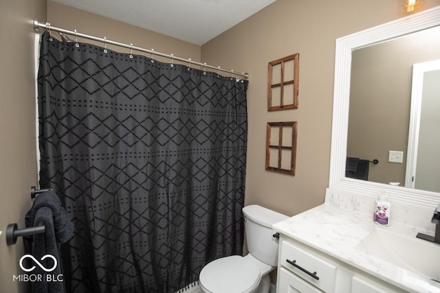 845 S Bay, North Vernon, IN 47265 - bathroom with vanity, toilet, and a shower with curtain