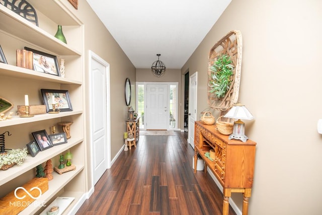 845 S Bay, North Vernon, IN 47265 - entryway with dark wood-type flooring, a chandelier, and baseboards