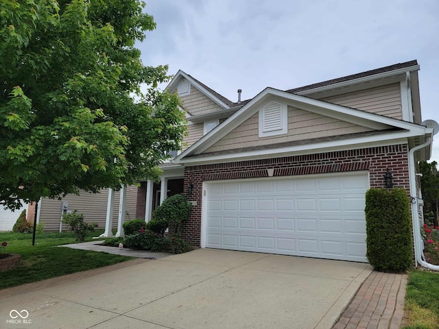 11070 Long Lake Ln, Fishers, IN 46037 - traditional-style house featuring brick siding, driveway, and a garage