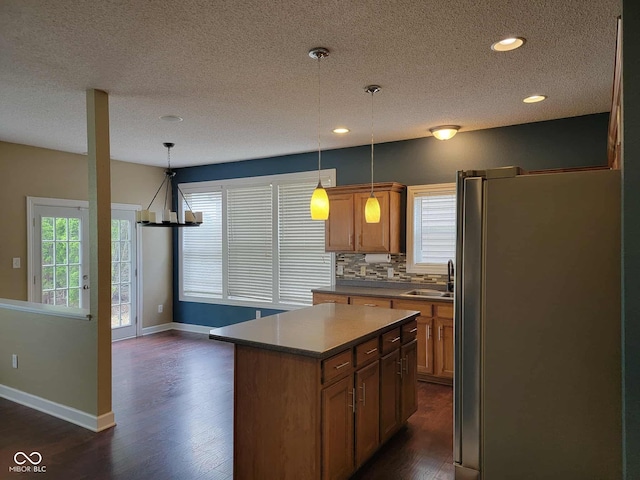 11070 Long Lake Ln, Fishers, IN 46037 - kitchen with freestanding refrigerator, a textured ceiling, dark wood-type flooring, a sink, and baseboards