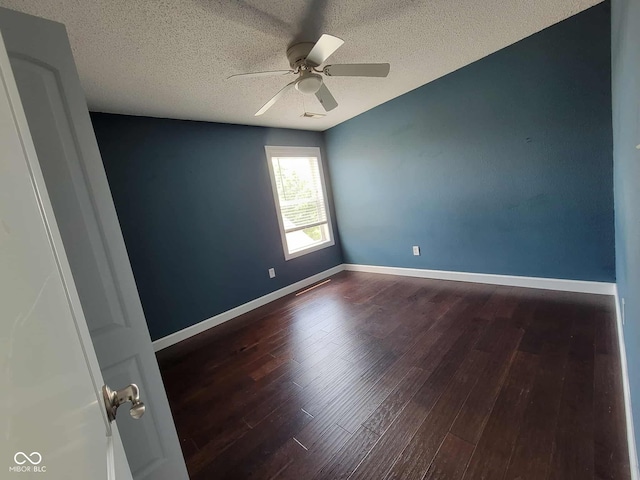11070 Long Lake Ln, Fishers, IN 46037 - spare room with ceiling fan, dark wood-style floors, a textured ceiling, and baseboards