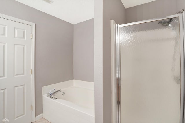 1024 Rotherham Ln, Beech Grove, IN 46107 - full bath featuring a stall shower, a garden tub, and baseboards