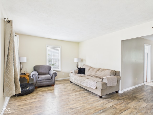 2405 E 9th St, Anderson, IN 46012 - living area with wood finished floors and baseboards