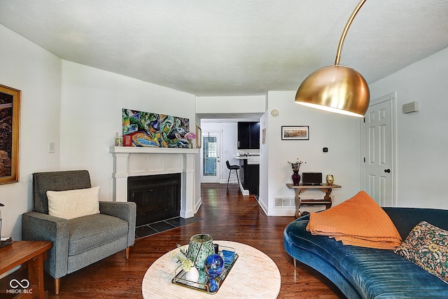 1548 N Park Ave, Indianapolis, IN 46202 - living area with wood finished floors and a fireplace with flush hearth