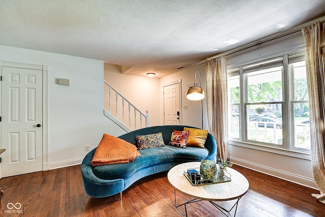 1548 N Park Ave, Indianapolis, IN 46202 - living room featuring stairs, a textured ceiling, baseboards, and wood finished floors
