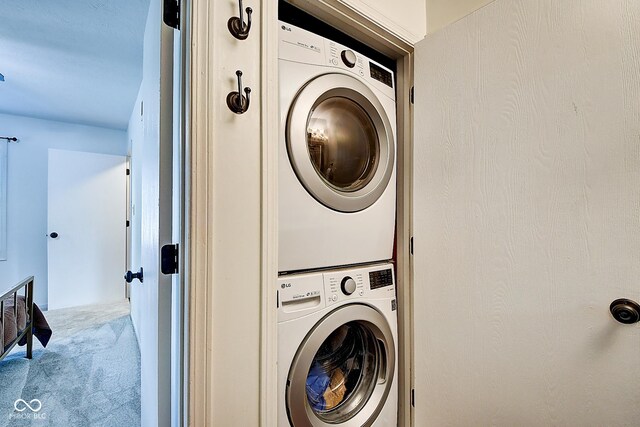 1548 N Park Ave, Indianapolis, IN 46202 - washroom with stacked washer / drying machine and carpet flooring