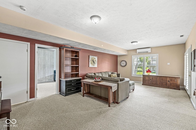 11244 Blackwalnut Pt, Indianapolis, IN 46236 - living area featuring an AC wall unit, carpet flooring, and a textured ceiling