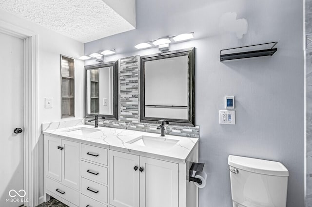 11244 Blackwalnut Pt, Indianapolis, IN 46236 - full bathroom featuring double vanity and a textured ceiling