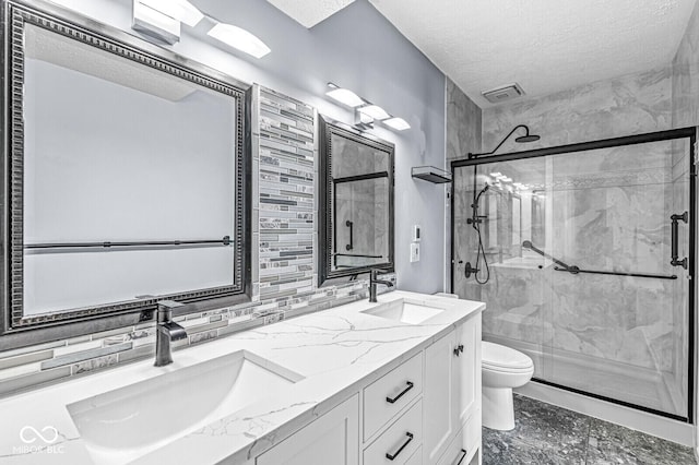 11244 Blackwalnut Pt, Indianapolis, IN 46236 - full bathroom with a textured ceiling, a marble finish shower, double vanity, and tasteful backsplash