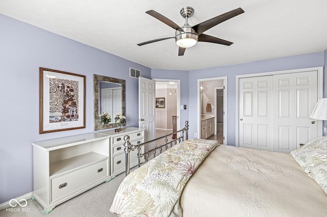11244 Blackwalnut Pt, Indianapolis, IN 46236 - bedroom with a closet, ensuite bathroom, light carpet, and a ceiling fan