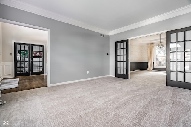 14149 Ledgewood Way, Carmel, IN 46032 - spare room featuring french doors, carpet floors, and ornamental molding