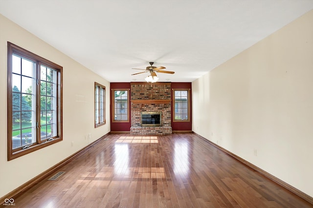 8619 Wrangler Ct, Indianapolis, IN 46217 - unfurnished living room featuring wood-type flooring, ceiling fan, and baseboards