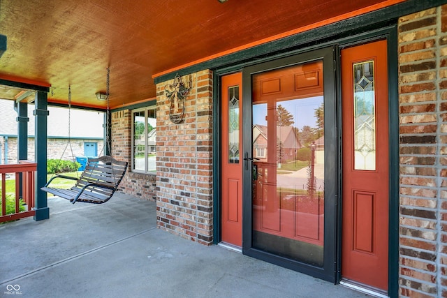 8619 Wrangler Ct, Indianapolis, IN 46217 - entrance to property featuring a porch and brick siding