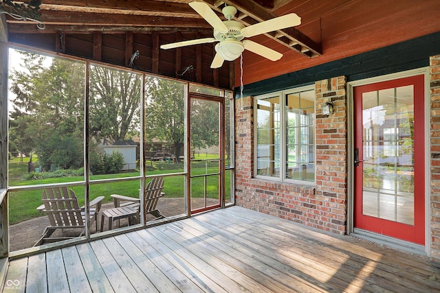 8619 Wrangler Ct, Indianapolis, IN 46217 - unfurnished sunroom with a ceiling fan and vaulted ceiling